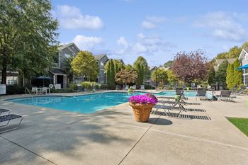 Shimmering pool with spacious sun deck